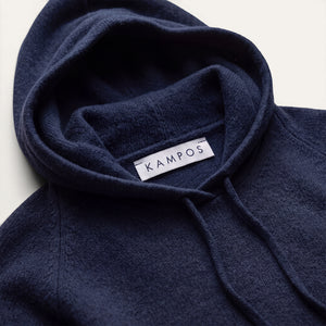Close-up detail of the dark navy KAMPOS cashmere hoodie
