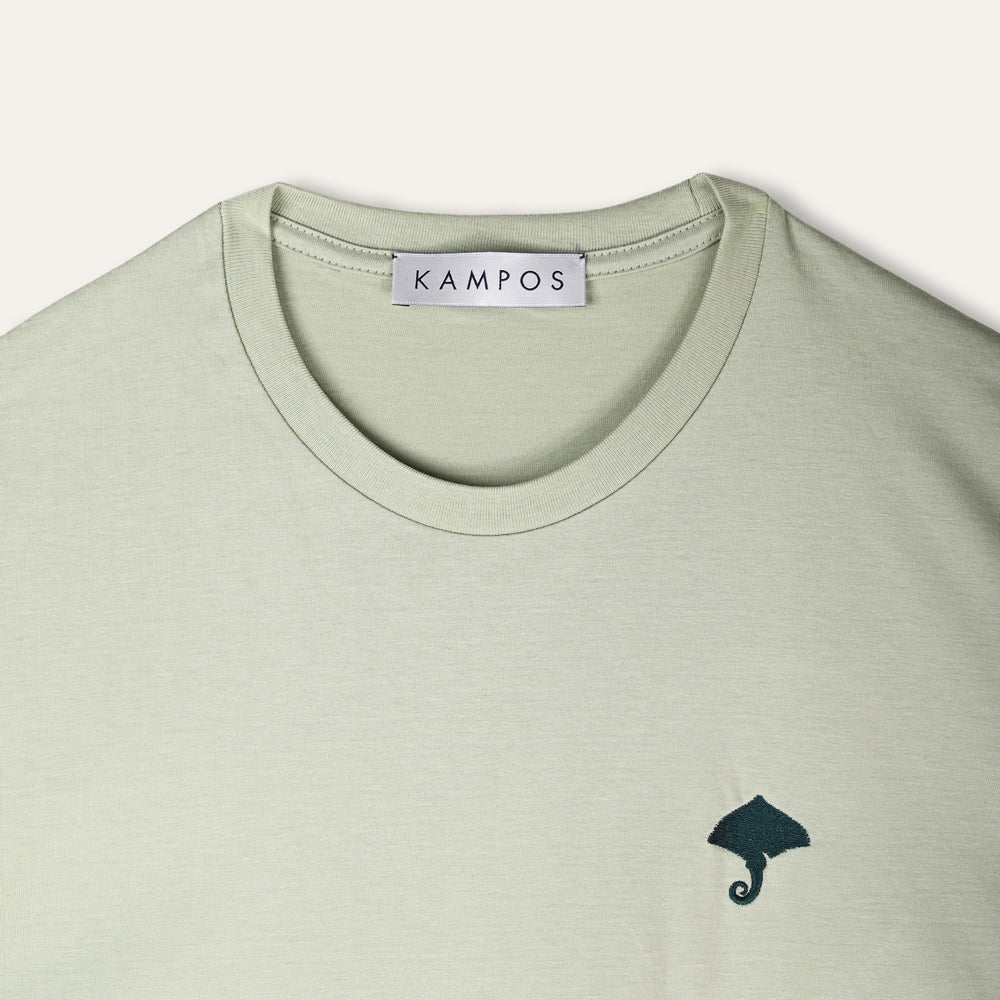 KAMPOS Ray T-shirt in pale sage green with dark teal ray motif, full front view